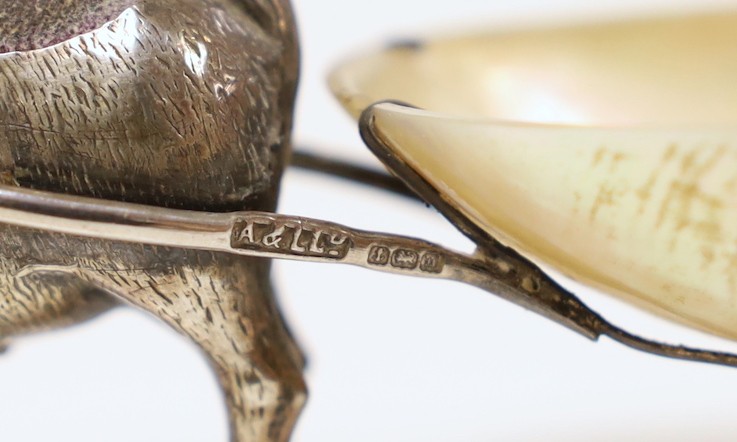 A George V silver and mother of pearl mounted novelty pin cushion, modelled as a goat pulling a cart, Adie & Lovekin, Birmingham, 1911, 11.2cm.